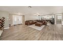 Spacious living room with wood-look flooring, perfect for entertaining and relaxing at 15525 Old Dixie Hwy, Hudson, FL 34667