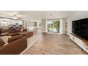 Open-concept living space with seamless flow to the outdoor patio and pool area at 15525 Old Dixie Hwy, Hudson, FL 34667