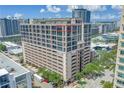 Exterior of high-rise building shows garages, balconies and some greenery at 175 2Nd St S # P-2, St Petersburg, FL 33701