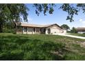 Charming single-story home featuring a stone accent and a well-manicured lawn at 271 Eastpoint Ct, Spring Hill, FL 34606