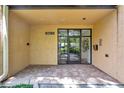 Exterior entry to the building with glass doors at 3062 Eastland Blvd # 311, Clearwater, FL 33761
