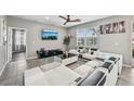 Bright living room featuring tile flooring, contemporary furniture, and lots of natural light at 4515 Bent Tree Blvd, Sarasota, FL 34241