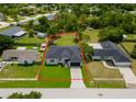 Aerial view of a single-story home with a lush lawn and a delineated property line at 5352 Lowell Ave, Spring Hill, FL 34609