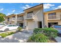 Exterior shot of townhomes, with balconies, garages, and well-kept landscaping at 6236 93Rd N Ter # 3502, Pinellas Park, FL 33782