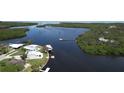 Overhead angle of waterfront homes showing docks, boats and winding channel through green mangrove islands at 6711 Arroyo Dr, New Port Richey, FL 34652
