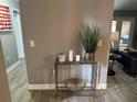 Stylish entryway featuring a glass console table with decorative accents and elegant decor, creating a welcoming ambiance at 9481 Highland Oak Dr # 1506, Tampa, FL 33647