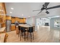 Modern eat-in kitchen featuring stainless steel appliances and an open floor plan at 13986 Bonnie Brae Dr, Largo, FL 33774