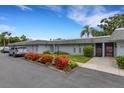 Exterior shot of condominiums with tidy landscaping and nearby parking at 4160 Fruitville Rd # 77, Sarasota, FL 34232