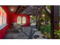 Comfortable seating with a view can be found on this covered front porch with decorative lattice roof at 5501 Highland S St, St Petersburg, FL 33705
