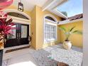Inviting front entrance featuring double doors, stone accents, and a decorative window at 1358 Forestedge Blvd, Oldsmar, FL 34677