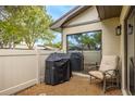 Outdoor patio with comfortable chair and grill, perfect for relaxation at 200 Gretchen Ct, Oldsmar, FL 34677