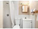 Functional bathroom with a shower, toilet, and sink at 2149 Dixie Garden Loop, Holiday, FL 34690