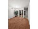 Dining room with a mirrored wall and view of living room at 2460 Persian Dr # 44, Clearwater, FL 33763