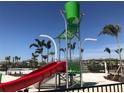 Community playground with a slide and a bucket to dump water for residents' enjoyment at 3926 Cat Mint St, Tampa, FL 33619
