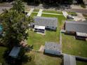 Aerial shot of the property showing the house, yard, outbuildings, and neighborhood at 5018 Pine St, Seffner, FL 33584