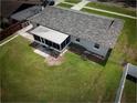 Aerial shot of backyard featuring a screened porch, perfect for outdoor relaxation at 5018 Pine St, Seffner, FL 33584