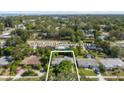 Aerial view showcases the property's location within a tree-lined neighborhood in Clearwater, FL at 1222 Palm St, Clearwater, FL 33755