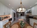 Elegant eat-in kitchen features modern stainless steel appliances, a kitchen island, and open layout at 17926 Calkins Ct, Spring Hill, FL 34610