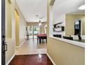 Inviting foyer with tile flooring leading to an open area with a pool table and a dining room at 2009 Raven Manor Dr, Dover, FL 33527