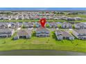 Water view home in residential neighborhood, featuring a large backyard at 2492 Overfalls Pl, Wesley Chapel, FL 33543