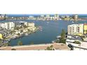 Scenic view of a bay dotted with boats and waterfront properties at 400 Island Way # 1606, Clearwater Beach, FL 33767
