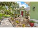 Landscaped front yard with decorative rock, plantings, and a welcoming walkway at 1271 Candlelight Blvd, Brooksville, FL 34601