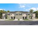 Charming townhomes featuring individual garages and neutral exteriors perfect for modern living at 17469 Spanish Oak Loop, Land O Lakes, FL 34638