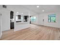 Spacious living area with open kitchen view and abundant natural light at 209 Se Jefferson N Cir, St Petersburg, FL 33702