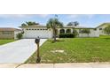 Well maintained home with an arched front porch and long driveway at 3633 Odom Dr, New Port Richey, FL 34652