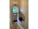 Grand foyer with a chandelier and soaring ceilings as you enter the home at 5154 Balsam Dr, Land O Lakes, FL 34639