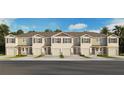 Exterior view of townhomes with garages, shutters, and landscaping under a blue sky at 2486 Riversong Lodge Ln, Wesley Chapel, FL 33543