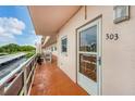 Cozy balcony with a view and unit number 303, perfect for enjoying a morning coffee at 5623 80Th N St # 303, St Petersburg, FL 33709