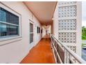 Exterior hallway providing access to the units and showcasing the building's architecture at 5623 80Th N St # 303, St Petersburg, FL 33709