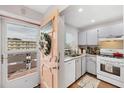 Efficient kitchen with white appliances, marble countertops, and stylish interior accents at 5623 80Th N St # 303, St Petersburg, FL 33709
