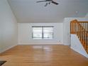 Spacious living room with hardwood floors, a large window, and natural light at 8759 Orient Ne Way, St Petersburg, FL 33702