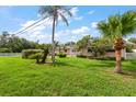 Well-maintained single-story home with a landscaped lawn and a charming covered entrance at 1453 Belleair Rd, Clearwater, FL 33756