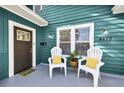 Inviting front porch with seating, perfect for relaxing outdoors at 4820 8Th S Ave, St Petersburg, FL 33711