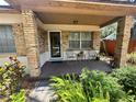 Inviting front porch with seating area perfect for enjoying the outdoors and neighborhood views at 5901 N 34Th St, Tampa, FL 33610