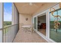 Tiled balcony with outdoor seating area, fan and lake views at 6450 Shoreline Dr Dr # 9202, St Petersburg, FL 33708