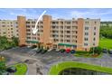 Exterior view of condo building with parking and landscaping at 6450 Shoreline Dr Dr # 9202, St Petersburg, FL 33708