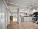 Well-lit kitchen featuring white cabinetry, stainless steel appliances, and granite countertops at 6450 Shoreline Dr Dr # 9202, St Petersburg, FL 33708