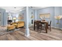 Inviting living room with modern furnishings, stylish decor, and wood-look flooring at 3725 Grand Forks Dr, Land O Lakes, FL 34639