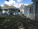 Spacious backyard featuring a storage shed, with some grassy areas at 4209 E Hanna Ave, Tampa, FL 33610