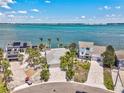 Waterfront property with bay access, lush landscaping and paved driveways at 980 Boca Ciega Isle Dr, St Pete Beach, FL 33706