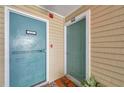 Condo entryway featuring unit number 129 and a welcome mat at 1000 W Horatio St # 129, Tampa, FL 33606