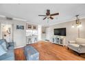 Inviting open-concept living area flows into the kitchen with breakfast bar seating at 1000 W Horatio St # 129, Tampa, FL 33606