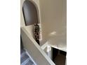 Elegant stairway with neutral walls and carpet leads to lower level at 1209 Alhambra Crest Dr, Ruskin, FL 33570