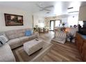 Comfortable living room features hardwood floors, neutral paint, and a cozy sitting area at 15817 Redington Dr, Redington Beach, FL 33708