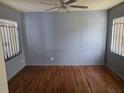 Bedroom with hardwood floors, freshly painted walls, and light-filtering window coverings at 2612 E 17Th Ave, Tampa, FL 33605