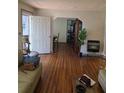Inviting living room featuring hardwood floors, neutral walls, and an open layout at 2612 E 17Th Ave, Tampa, FL 33605